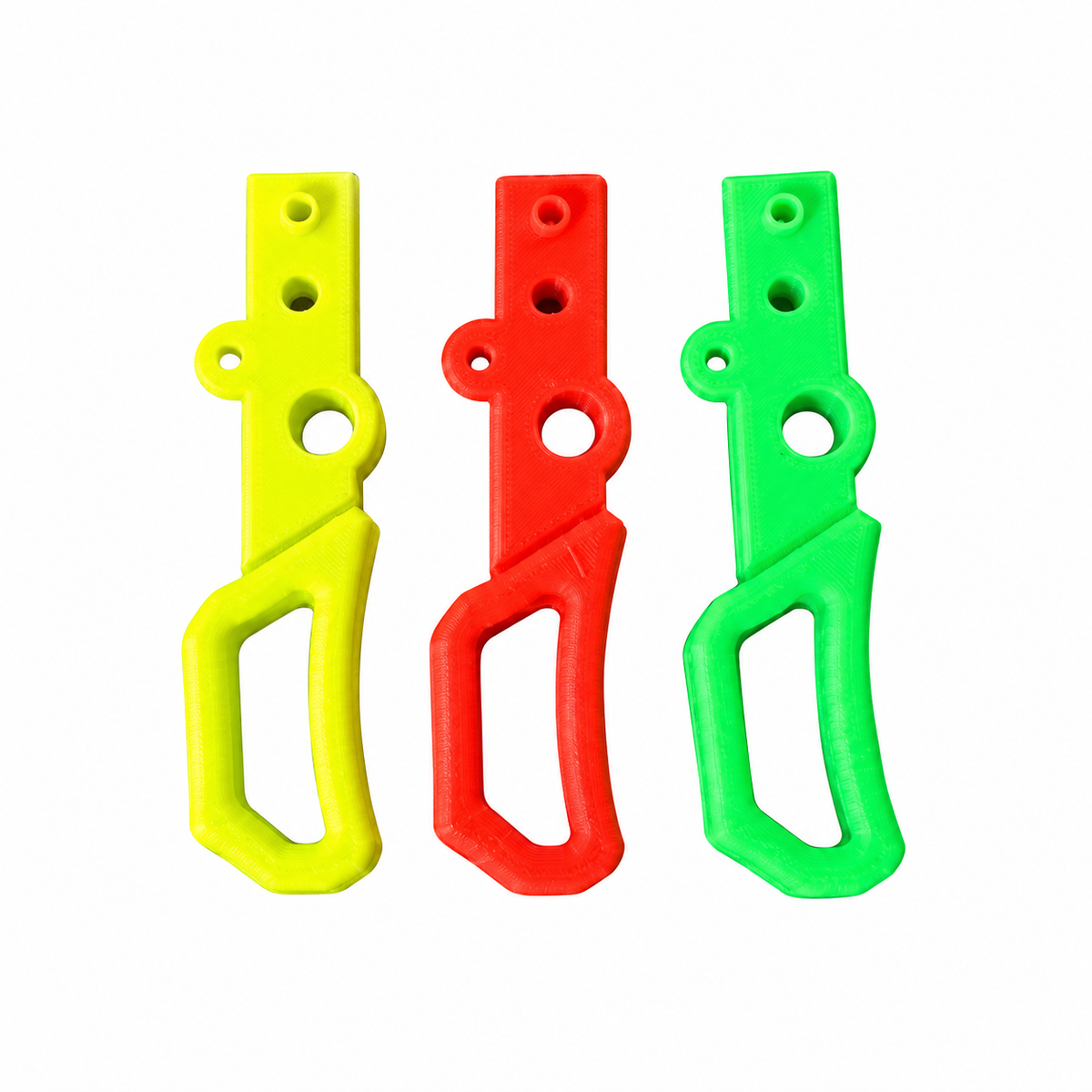 Gatillos de 1 dedo K3D para mando Professor Motor en amarillo, rojo y verde sobre fondo blanco